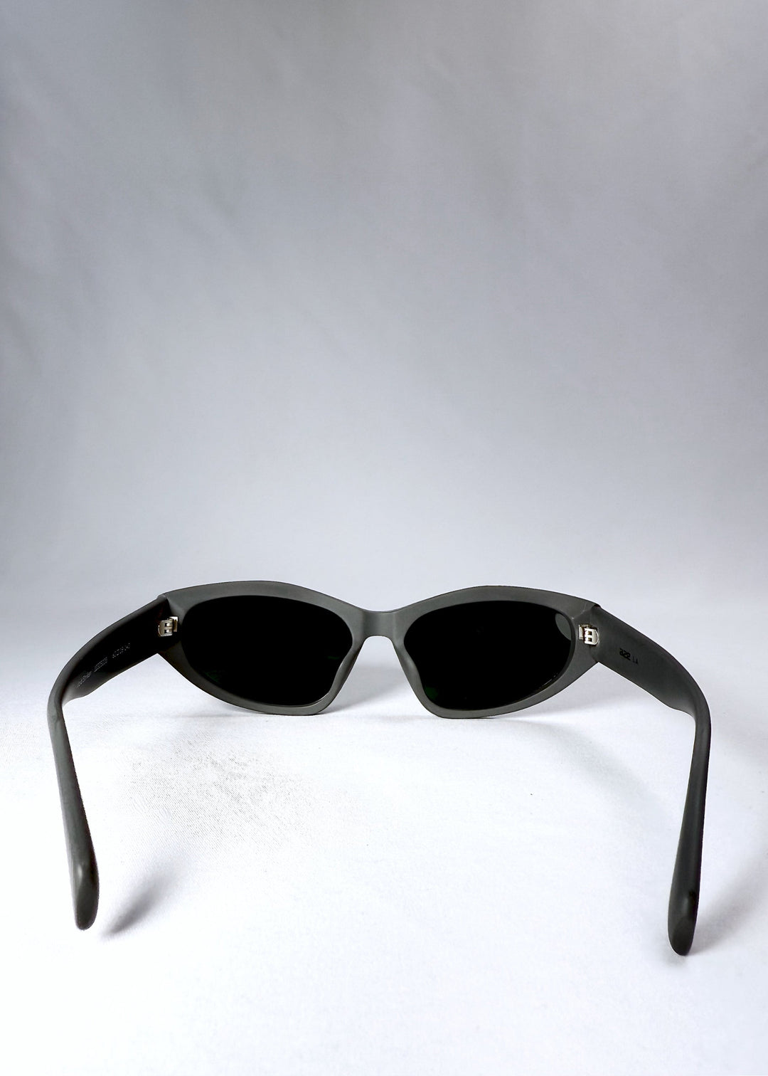 Back view showcasing the clean temple design and fixed nose bridge of the Void Striker in Carbon Ash. 