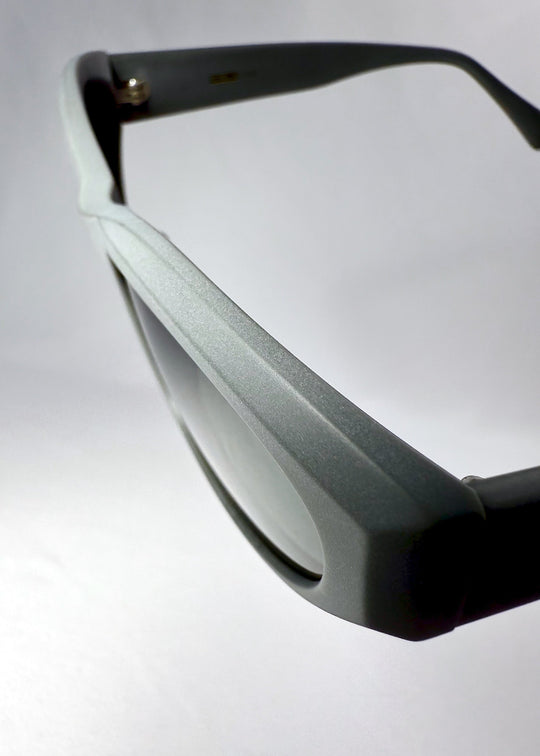 Detail shot of the geometric acetate frame edge and matte finish on the Void Striker sunglasses. 