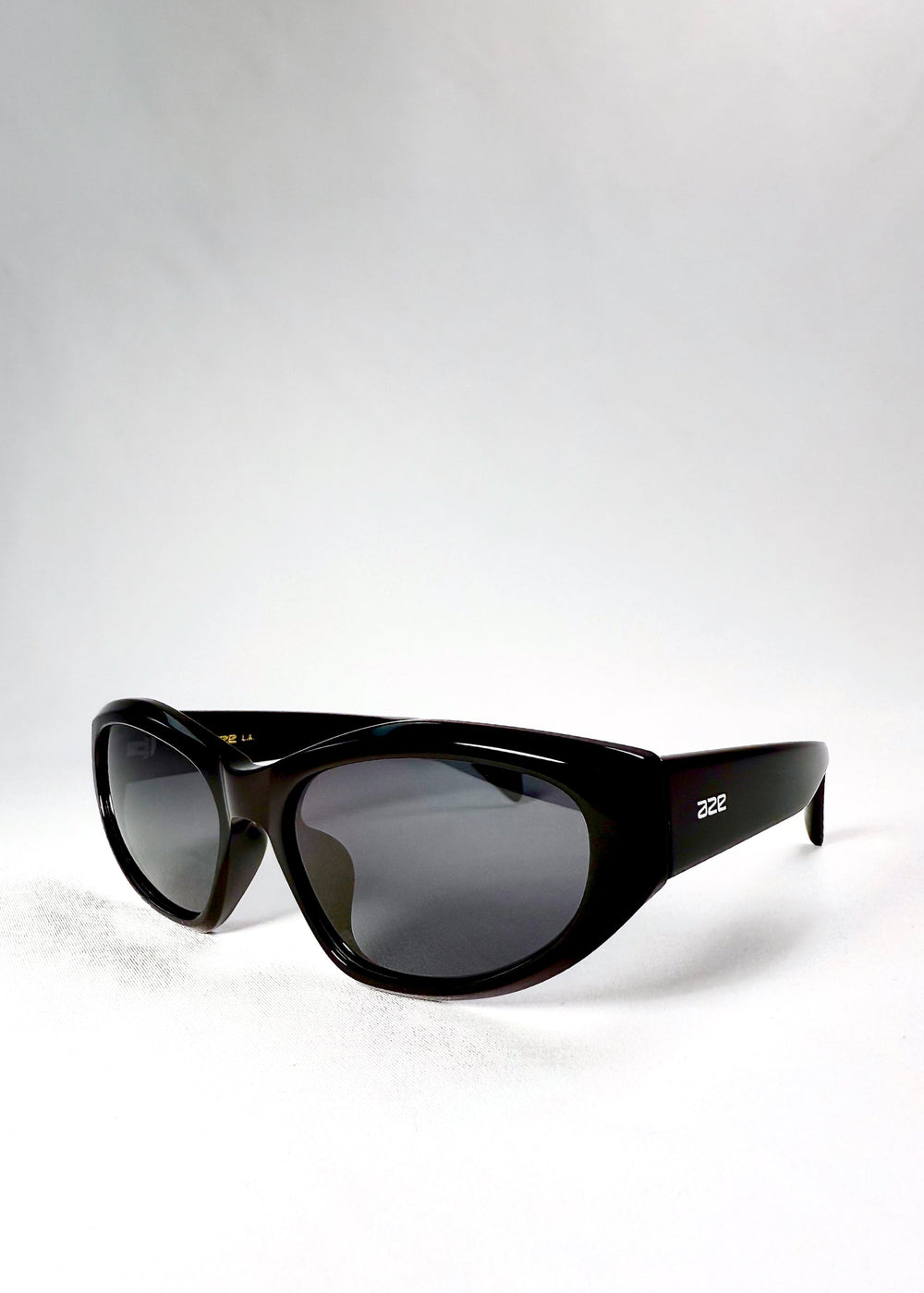  Angled front view of Void Striker sunglasses in Obsidian Black featuring geometric acetate frame and high-gloss finish. #color_obsidian-black