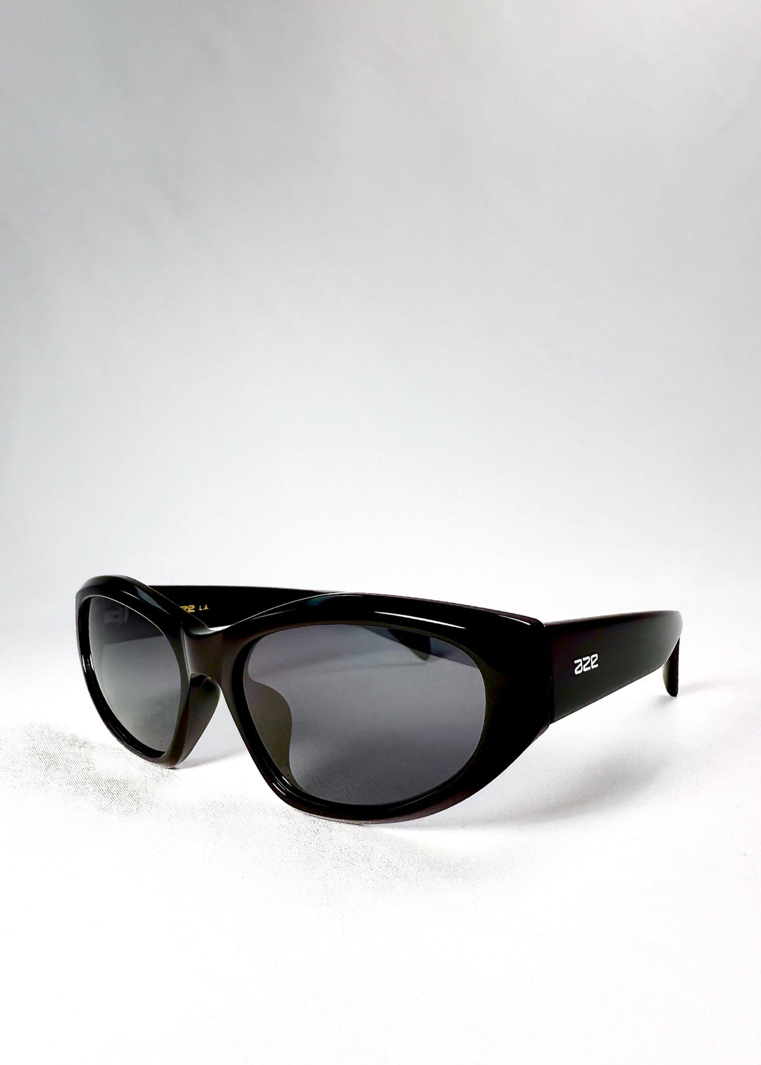  Angled front view of Void Striker sunglasses in Obsidian Black featuring geometric acetate frame and high-gloss finish. 