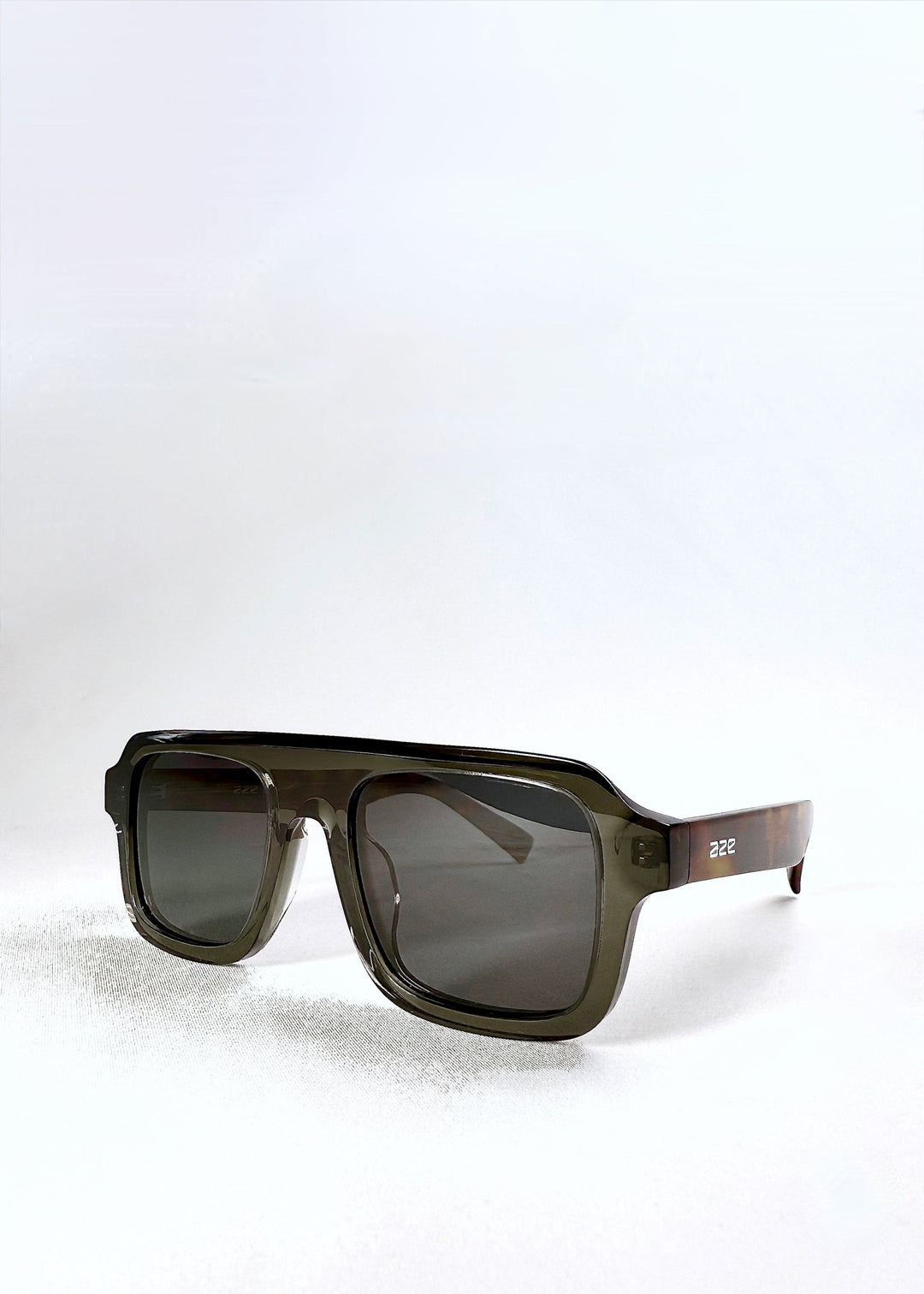 Vortex Edge - Ash Tortoise sunglasses in a three-quarter front angle view, featuring bold rectangular lenses and sculpted acetate design. 