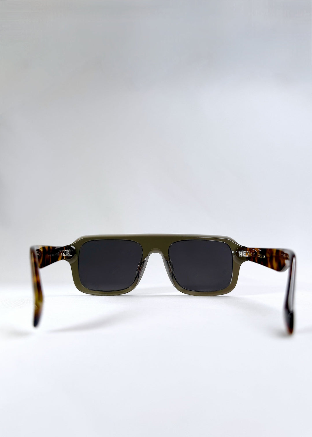 Rear angle view of Vortex Edge - Ash Tortoise with arms open, emphasizing ergonomic fit and frame construction. 