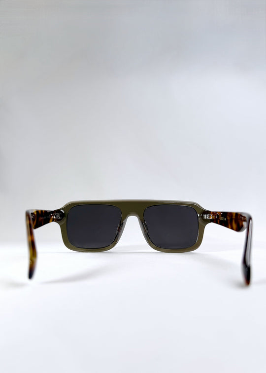 Rear angle view of Vortex Edge - Ash Tortoise with arms open, emphasizing ergonomic fit and frame construction. 