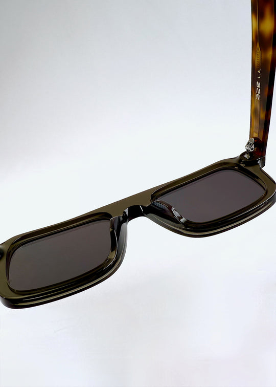 Top-down close-up of the Vortex Edge - Ash Tortoise frame showing intricate acetate transitions and internal hinge details. 