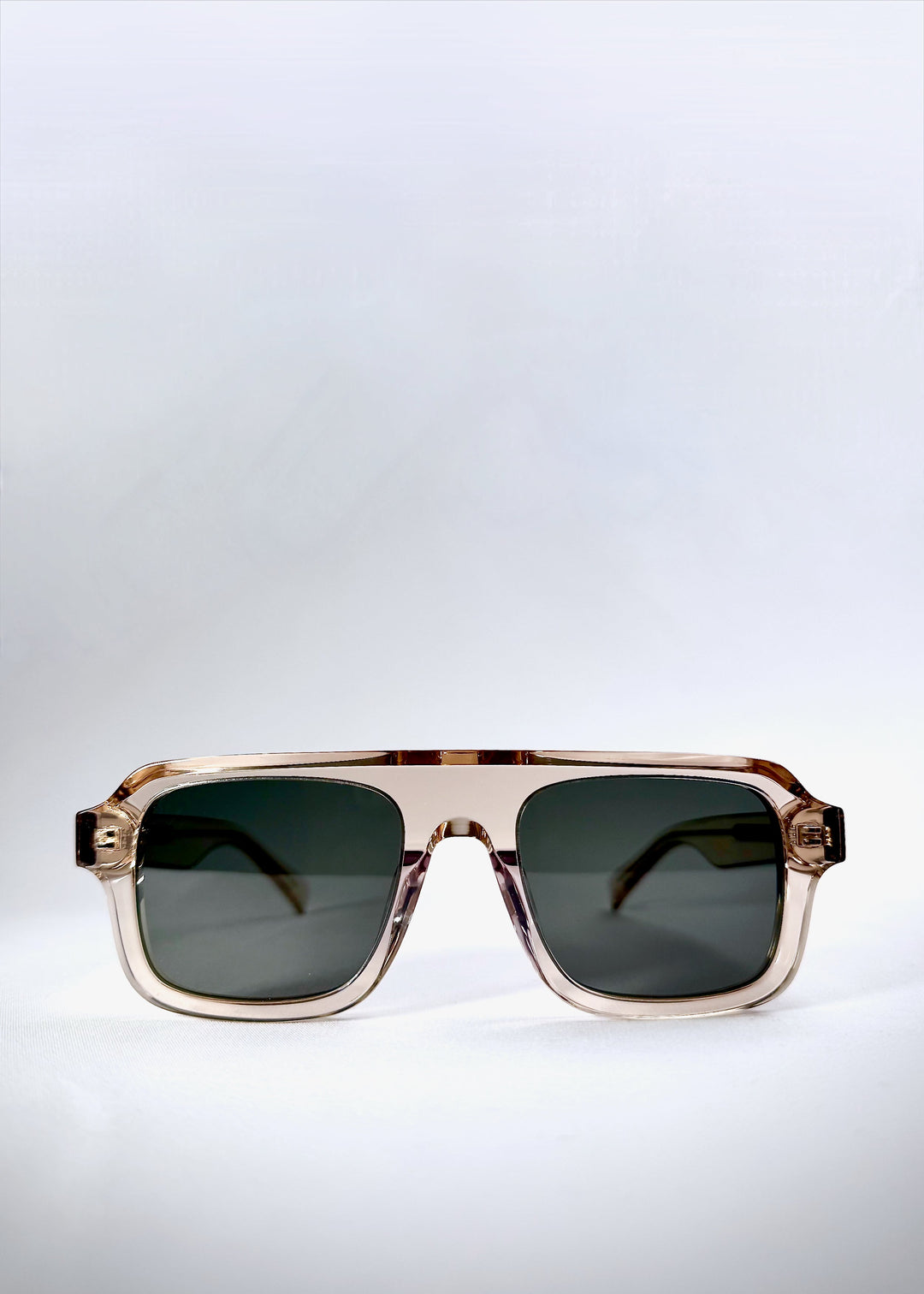 Front view of Vortex Edge - Champagne Glow sunglasses featuring a structured rectangular acetate frame with  polarized lenses 