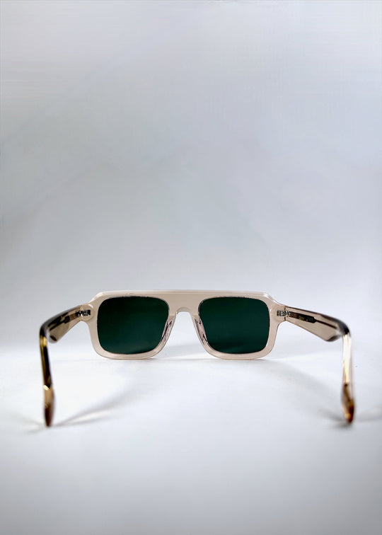Rear view of Vortex Edge - Champagne Glow showing the fixed nose bridge and clean temple lines in translucent beige acetate. 
