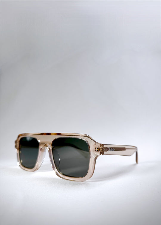 Three-quarter front angle of Vortex Edge - Champagne Glow, showcasing the frame’s structured silhouette and subtle transparency. 