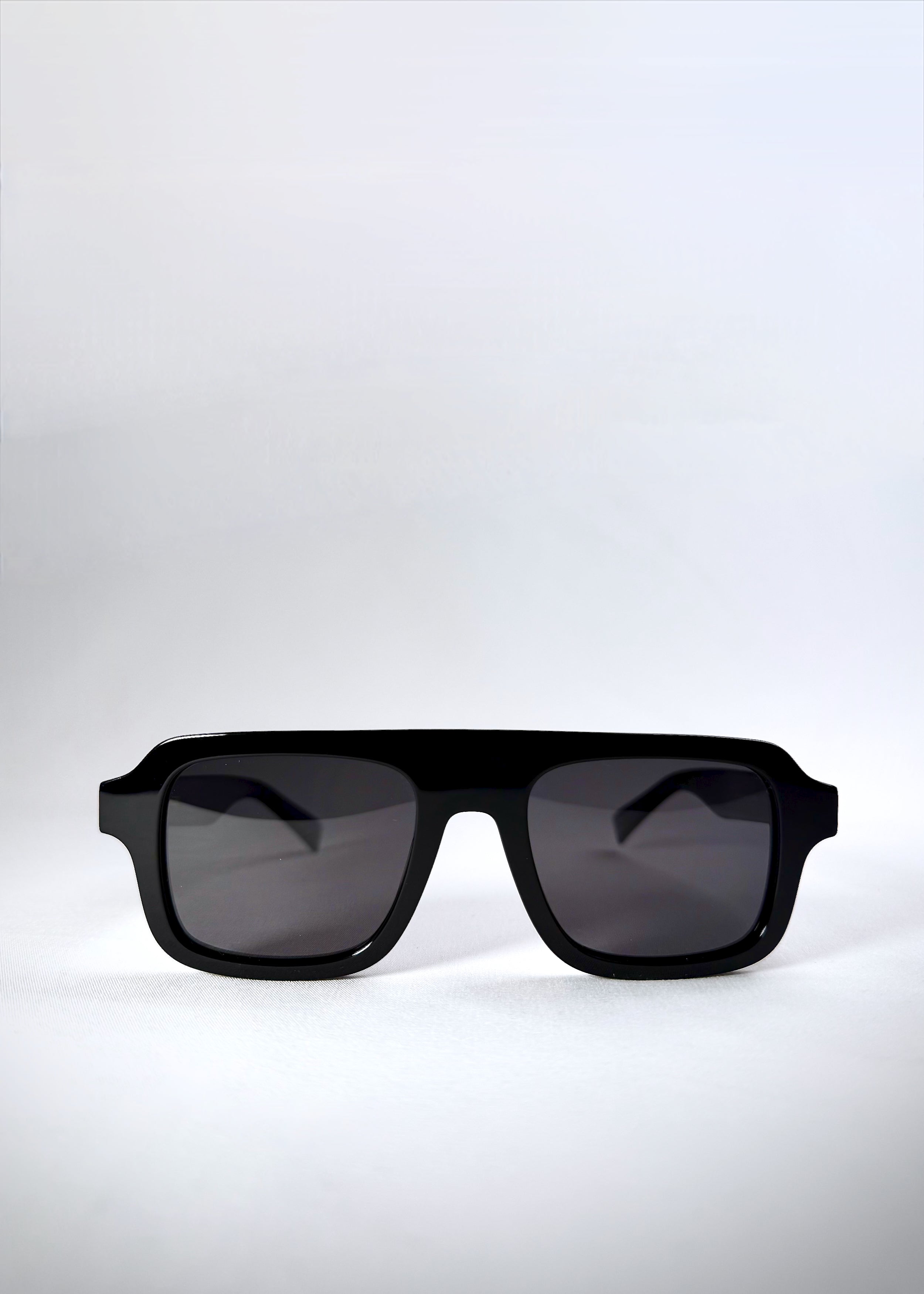 Front view of Vortex Edge sunglasses in Obsidian Black, highlighting the bold boxy silhouette.