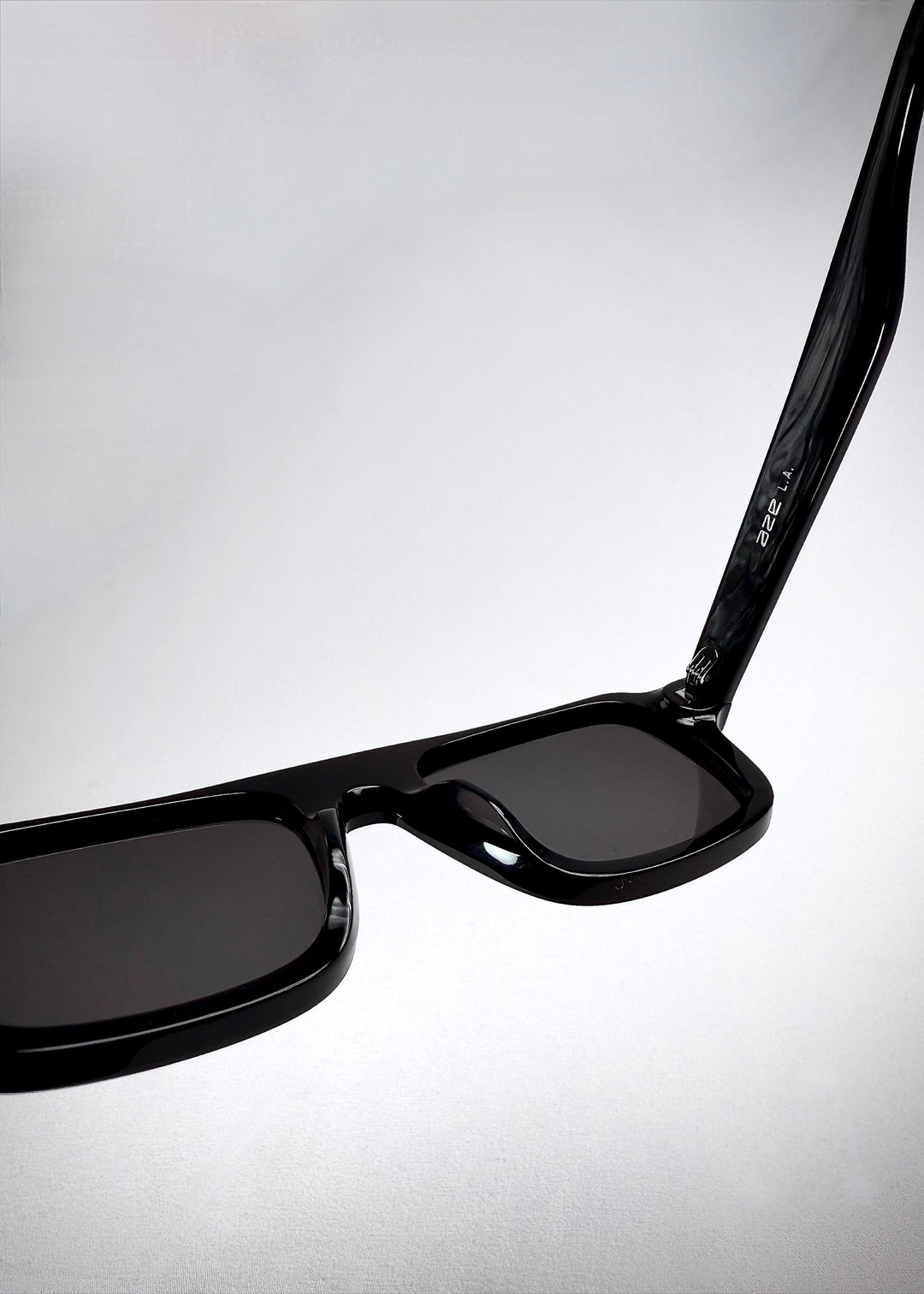 Interior frame markings on Vortex Edge sunglasses in Obsidian Black, showing model and size details. 