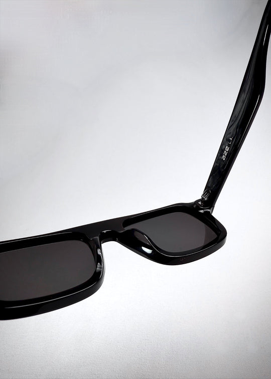 Interior frame markings on Vortex Edge sunglasses in Obsidian Black, showing model and size details. 