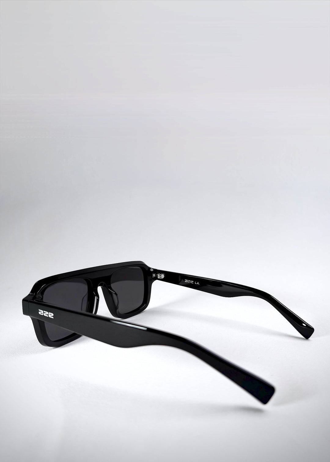 Side view of Vortex Edge sunglasses in Obsidian Black, featuring thick acetate arms with Aze branding. 
