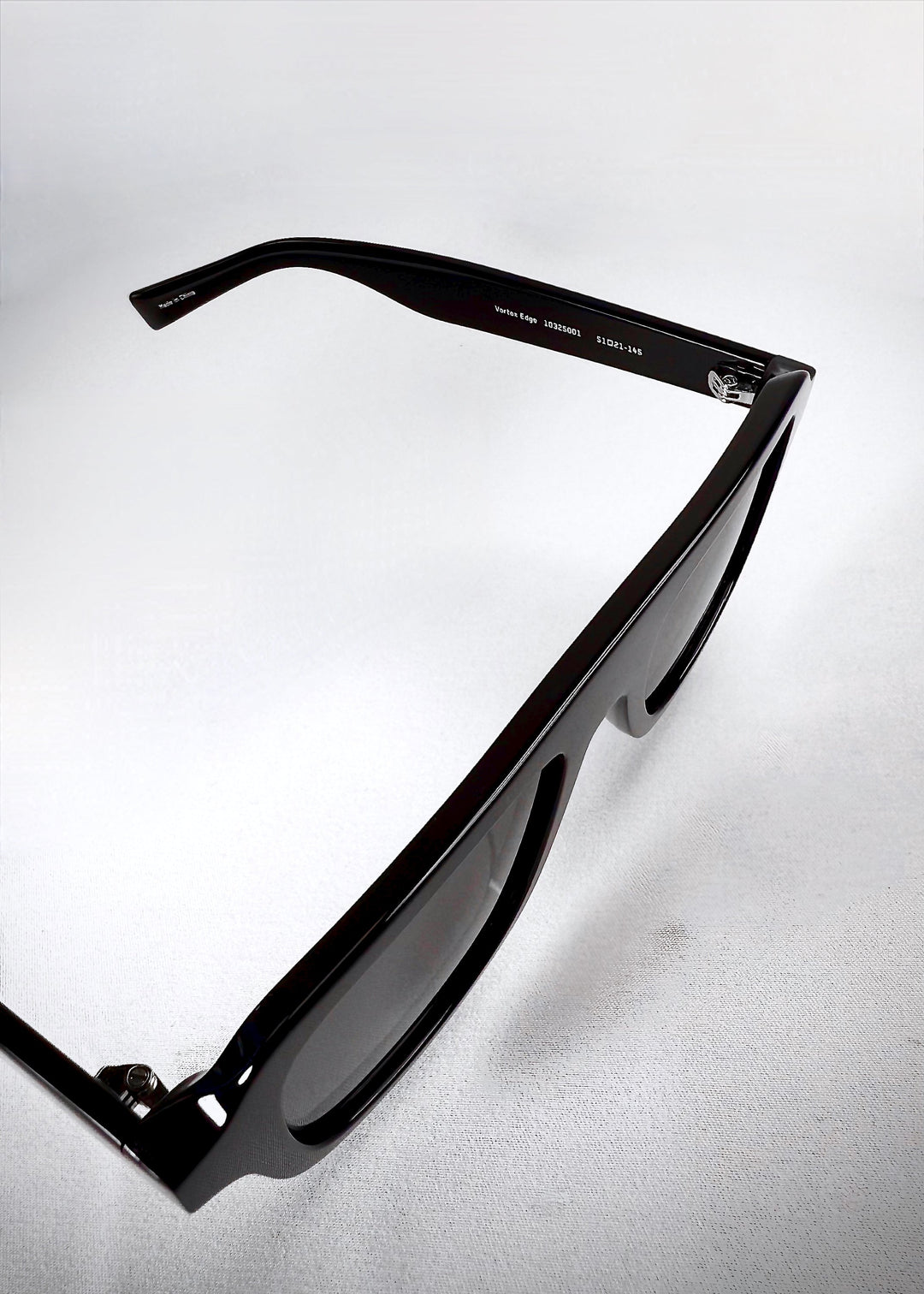 Detailed view of the Vortex Edge temple, displaying the curved acetate arm. 