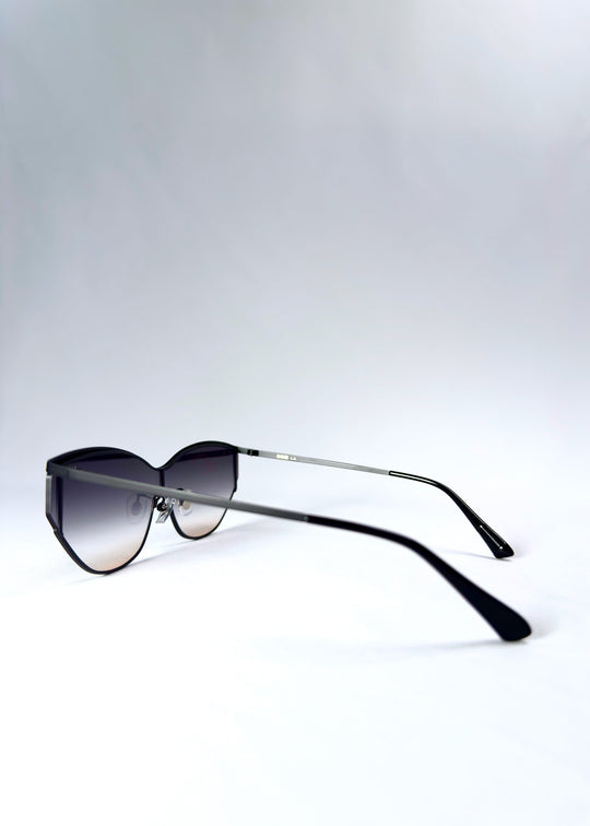 Side view of Zenith sunglasses in Midnight Eclipse, showing the slim stainless-steel temples and semi-rimless lens edge. 