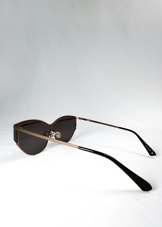 Side view of Zenith sunglasses in Mocha Steel, showing the slim stainless-steel temples and dark lenses. 