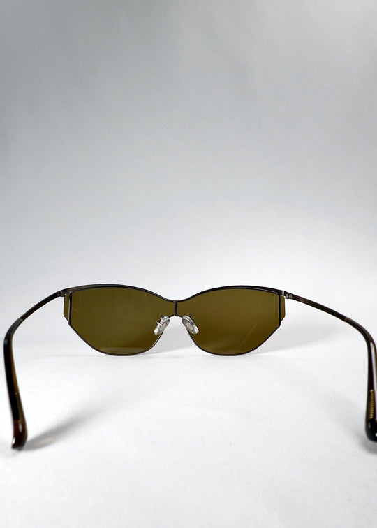 Back view of Zenith sunglasses in Olive Smoke, showing the inner lens curvature, adjustable nose pads and open temples. 