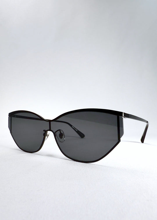 Three-quarter front view of Zenith sunglasses in Onyx Black, highlighting the matte black stainless-steel frame and dark lenses. 
