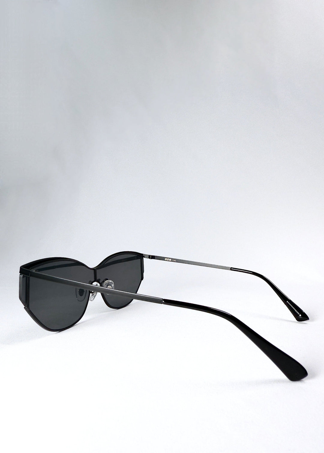 Side view of Zenith sunglasses in Onyx Black, showing the slim black temples and semi-rimless lens profile. 