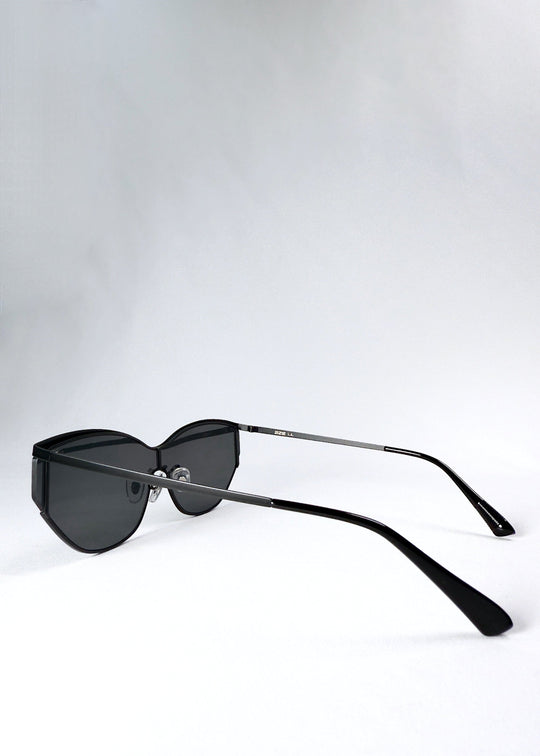 Side view of Zenith sunglasses in Onyx Black, showing the slim black temples and semi-rimless lens profile. 